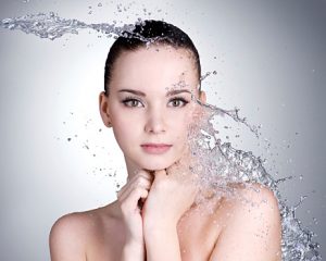 Beautiful woman and splashes of water